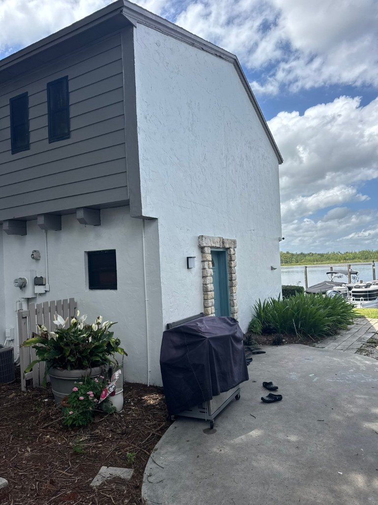 After photo showing refreshed home exterior following painting and upgrades