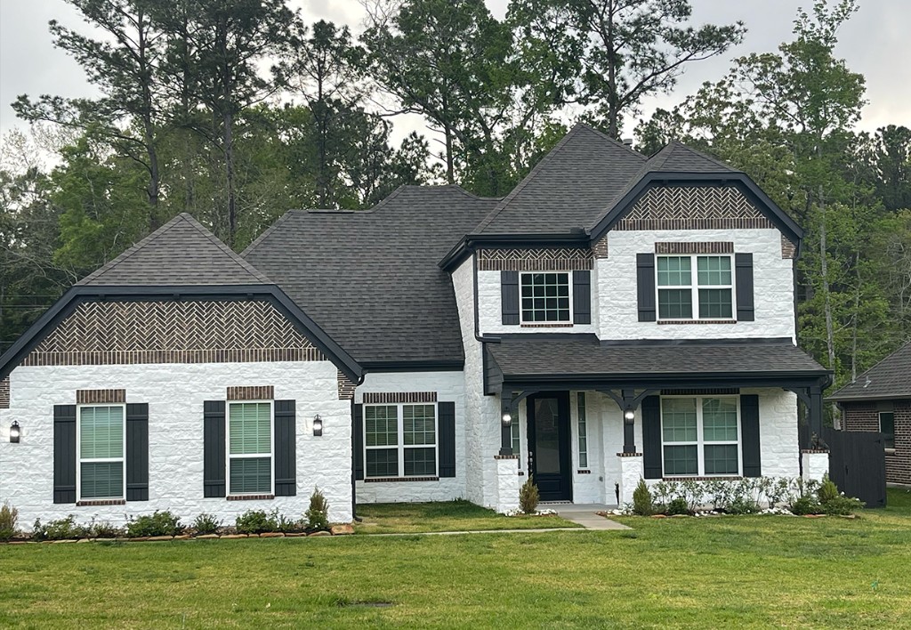 After photo of home exterior with upgraded modern paint colors and finishes