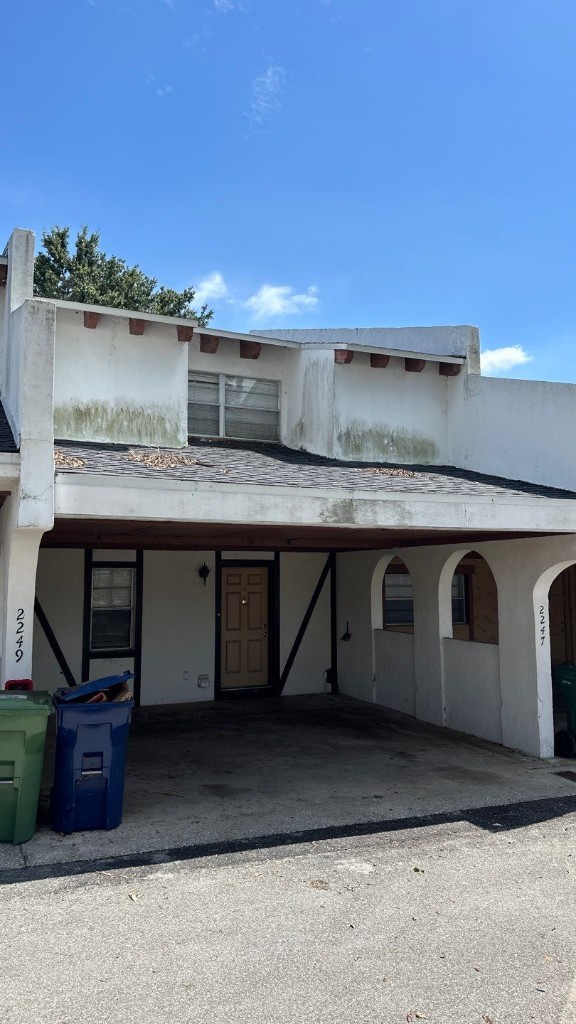 Weathered residential exterior showing stains and wear before painting and restoration